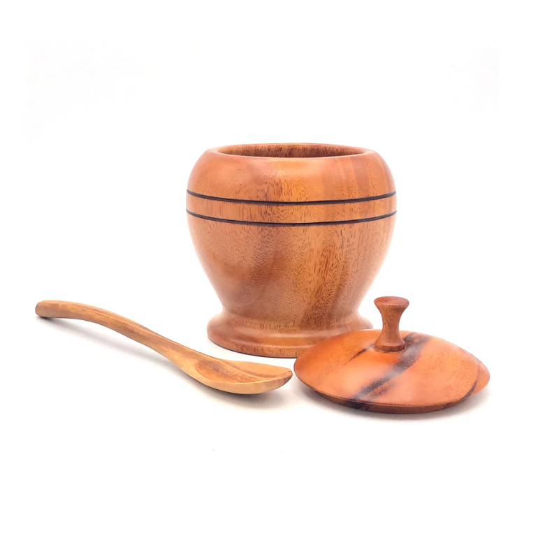 Handcrafted wooden sugar bowl with a smooth finish, paired with a matching lid and spoon. Ideal for storing sugar, honey, or condiments, combining functionality with rustic elegance.