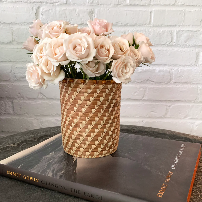 Handwoven Pine Needle Basket with Beaded Rim – A stunning decorative accent filled with soft roses, showcasing intricate craftsmanship, eco-friendly design, and versatile functionality for any space.